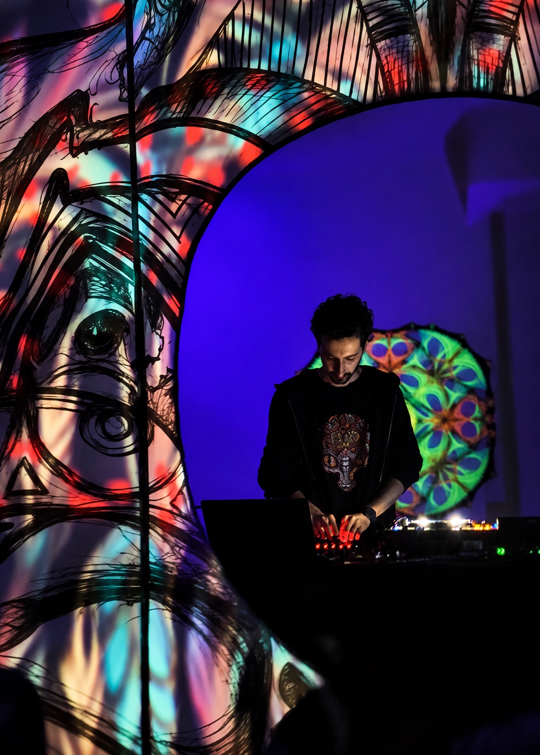 KOOROW performing electronic music with colorful psychedelic stage visuals